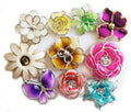Assorted plastic flower trims in various designs and colours.