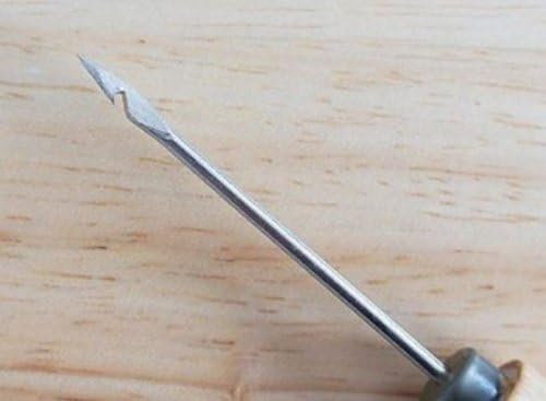Close-up of the blade of the wooden stitching awl
