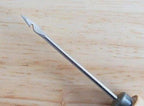 Close-up of the blade of the wooden stitching awl