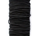 Large roll of round white polyester woven elastic