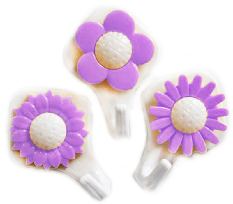 Three sunflower self adhesive hooks displayed on a wall