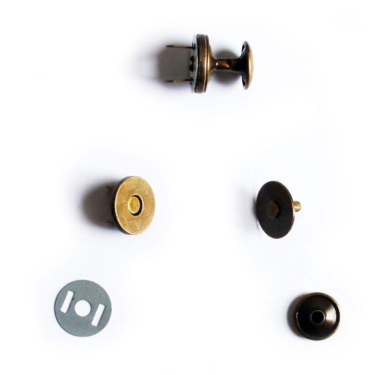 Close-up of vintage gold magnetic press studs in 14mm size.