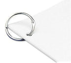 Binding rings displayed with papers and swatches for organisation.