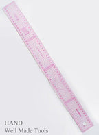 Ruler being used to grade a clothing pattern on paper