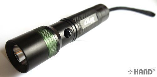 LL-C12 handheld multi-purpose flashlight torch on a table
