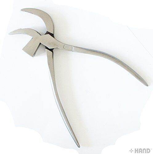 Pliers being used for shoe making and leather repair