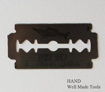Close-up of FLAG FISH round cutter blades for textiles.