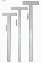 Large T Square acrylic ruler on a crafting table.