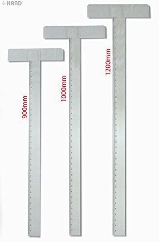 Large T Square acrylic ruler on a crafting table.