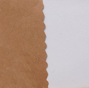 Scissors cutting through colourful paper for crafts.