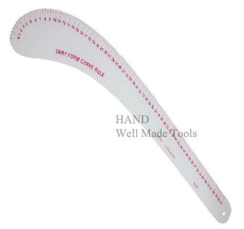 Flexible curve ruler being used to draw a curve on paper