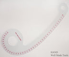 Pattern ruler displayed on a fabric background