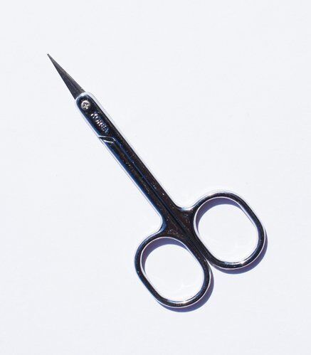 Curved blade of the embroidery scissors designed for intricate work.
