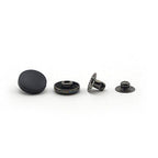 Pack of 20 black plastic press studs displayed together.