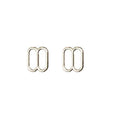 Close-up of metal lingerie sliders in silver colour.
