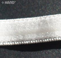 Packaging of the black elastic gel stop tape displayed neatly.