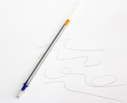 Close-up of clear mark silver pen lead on a piece of leather.