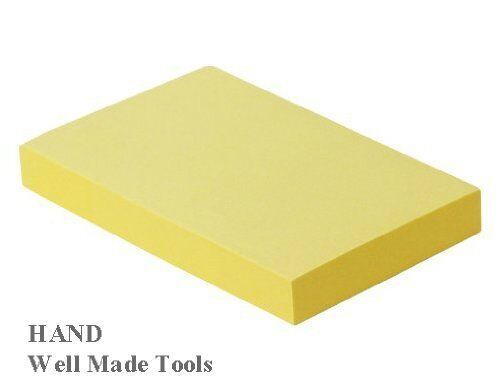 Close-up of a canary yellow sticky note pad, showing the 3x4 inch size.