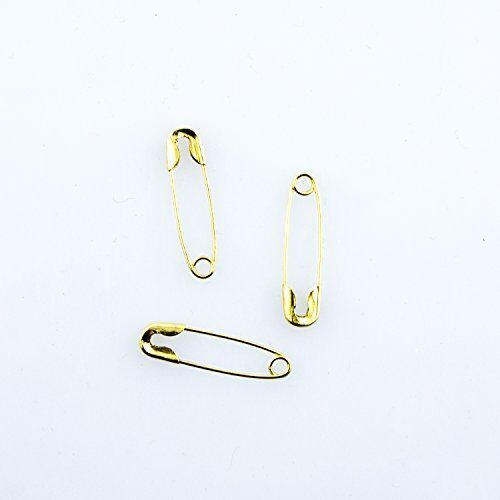 Close-up of gold tone safety pins in a box.