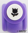 Tulip shape craft paper punch on a wooden table