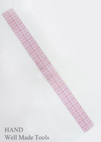 Graph ruler placed on a crafting surface for use