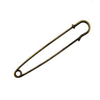 Gold kilt pins arranged neatly, perfect for crafting.