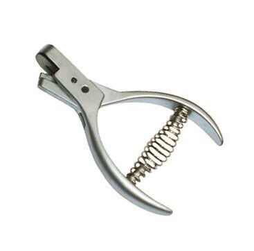 Portable pattern notcher showing its ergonomic design.
