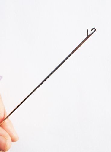 Loop turner in use turning a strap inside out