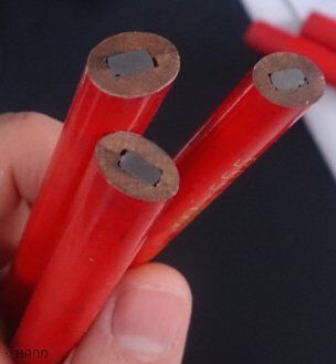 Close-up of a flat point carpenter pencil with wood shavings