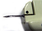 Close-up of the tagging gun's needle and attachment mechanism