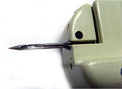 Close-up of the tagging gun's needle and attachment mechanism