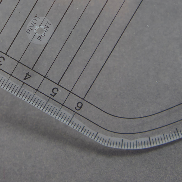 Ruler placed on fabric for pattern marking demonstration.