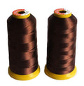 Two spools of assorted polyester threads in vibrant colours.