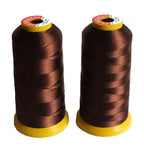 Two spools of assorted polyester threads in vibrant colours.