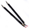 Two wooden sumi brushes displayed on a white background.