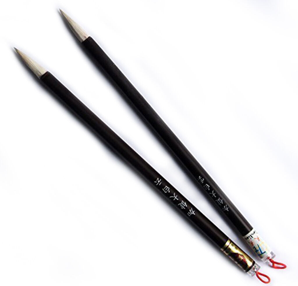Two wooden sumi brushes displayed on a white background.