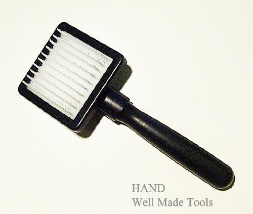 Fur care brush with plastic bristles for cleaning