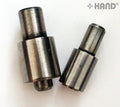 Button dies and short cutter set displayed on a table