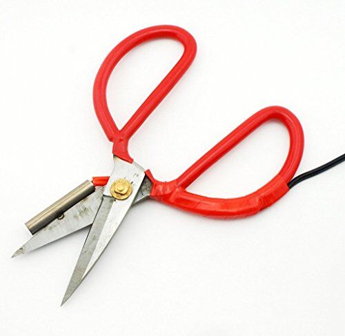 Scissors cutting fabric with a clean, sealed edge