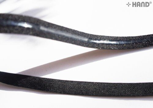 Black underwear elastic gel stop tape on a white background.