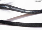 Black underwear elastic gel stop tape on a white background.