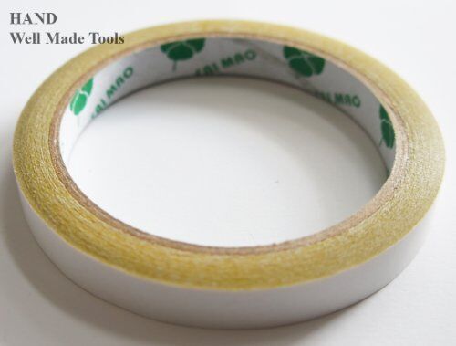 Display of double sided tape rolls, perfect for crafting and design.