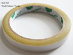 Display of double sided tape rolls, perfect for crafting and design.