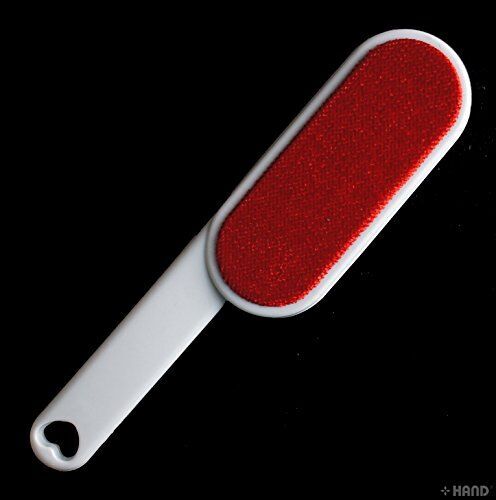 Magical double sided lint brush with self-cleaning feature