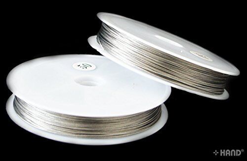 Crafting tools alongside the icy silver plastic coated wire