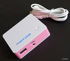 Power bank with various devices it can charge, including tablets.