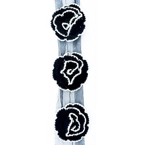 Knitted black and white edge decorative rosettes trim on net backing.