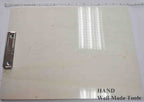 Clipboard holding sheets of paper for drawing