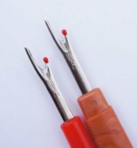 Unpicker in use, demonstrating its seam unpicking capability.