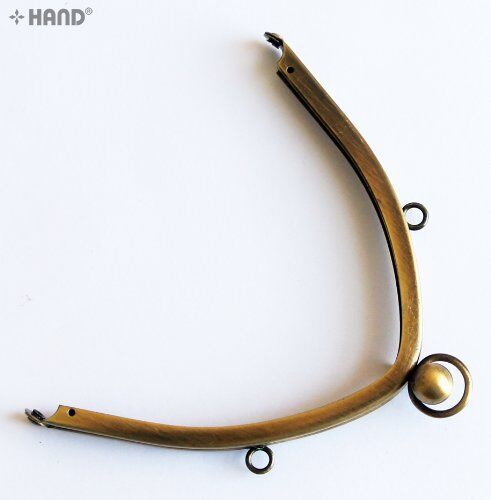 Different angles of the vintage gold purse frame displayed.